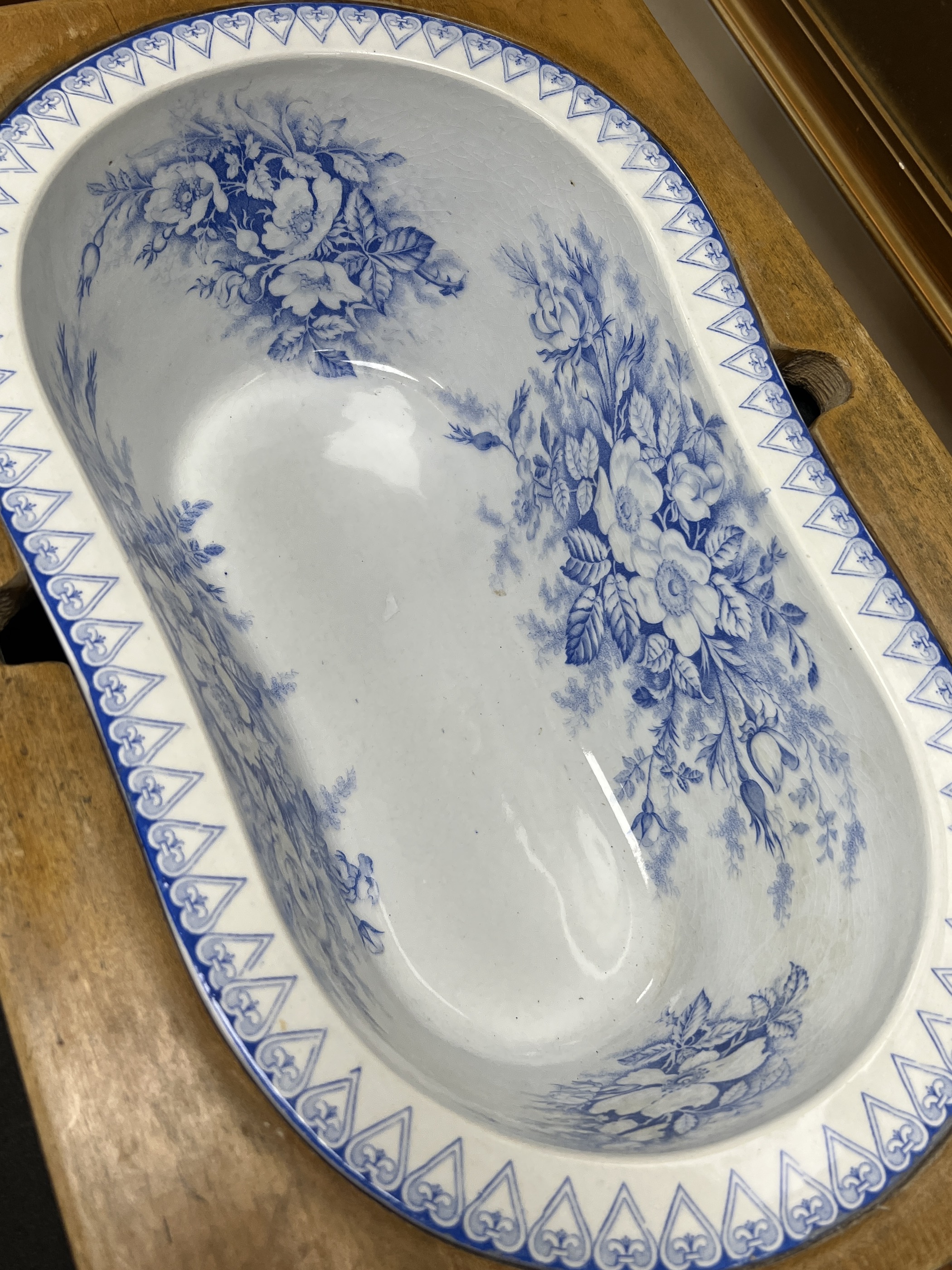 A 19th century French faux bamboo rectangular bidet with blue and white ceramic liner, width 52cm, depth 36cm, height 42cm